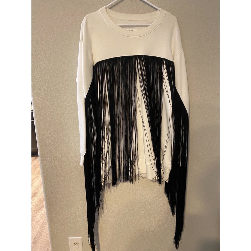 MM6 sweater with fringe detail on the front.